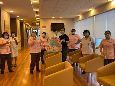 A bunch of nurses and doctors having an event at a hospital.